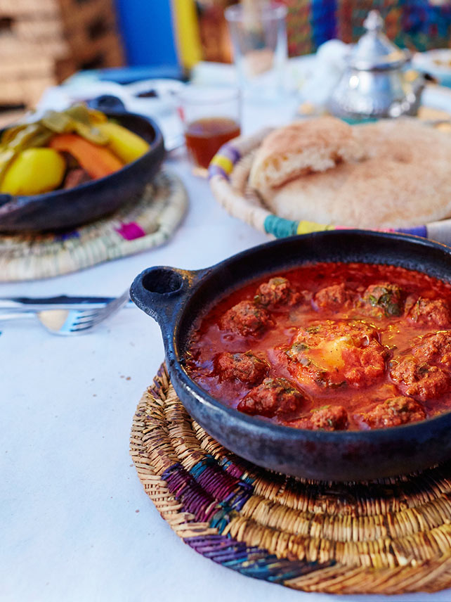 Traditional Moroccan kefta - tagine with meatballs and baked egg in tomato sauce. ©encrier.