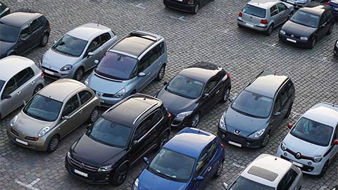 Cars parked in rows.