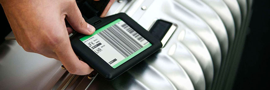 Digital bag tag attached to a suitcase.