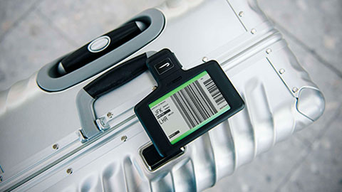 Digital bag tag on metal suitcases
