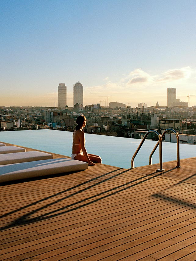 Watch the sun rise over Barcelona from the heated outdoor pool at the Grand Hotel Central. © Grand Hotel Central.