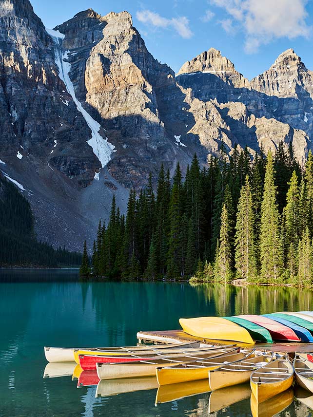 Go canoeing on bright blue Lake Louise © Erik Pronske / Getty.