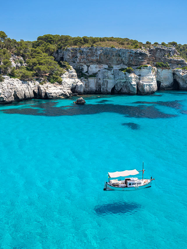 Go deeper: snorkel in the clear blue waters surrounding Menorca © Westend61/Getty Images