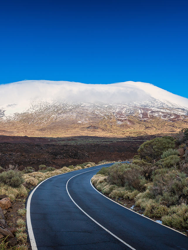 A road curves through Teide National Park in Tenerife. © Allard Schager.