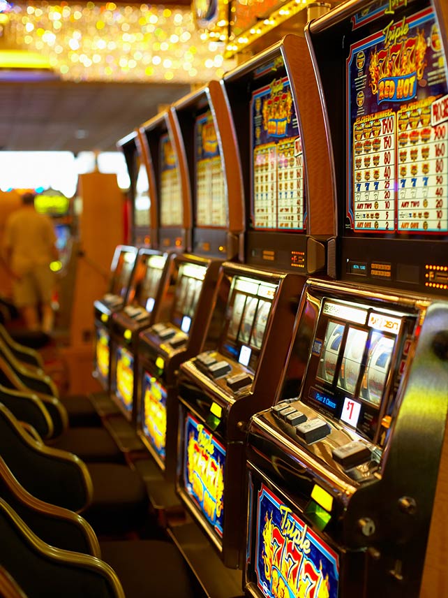 Slot machines in a casino. ©Jupiterimages.