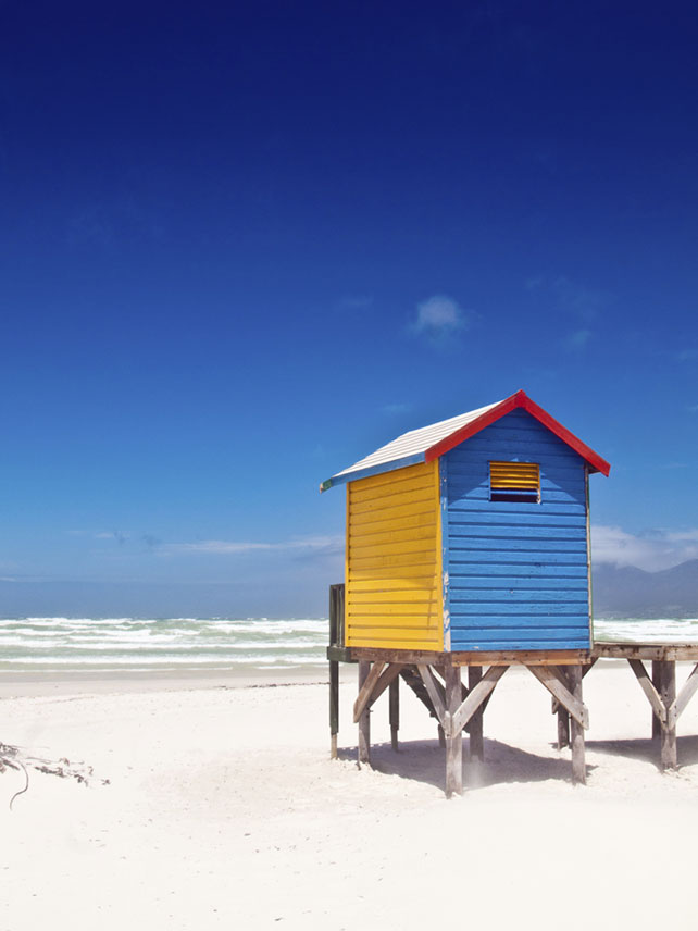 Colourful beach huts on Muizenberg Beach, Cape Town, South Africa. Photo by Ferrantraite