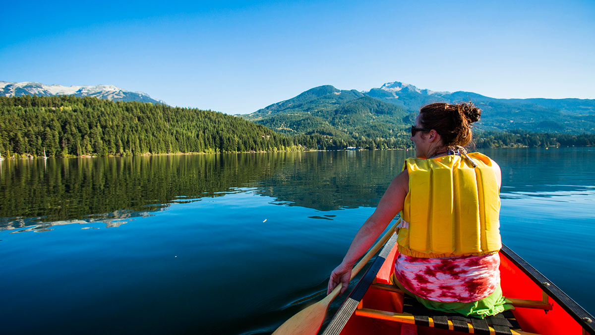 Canoeing on a calm lake in Whistler, Canada. Photo credit: Visual Communications.