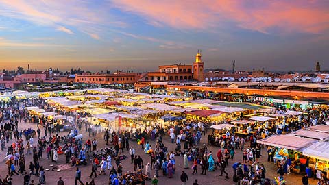 Evening Djemaa El Fna Square with Koutoubia Mosque, Marrakech, Morocco.