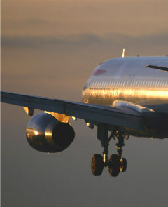 Airbus A320-200 on approach in sunset (photo by Andrew Simpson).