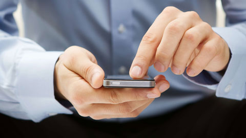 Close up of a person using a smartphone.