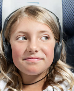 Girl on board with head phones.